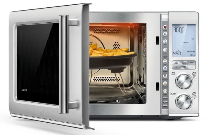 Microwave with door open showing air fryer